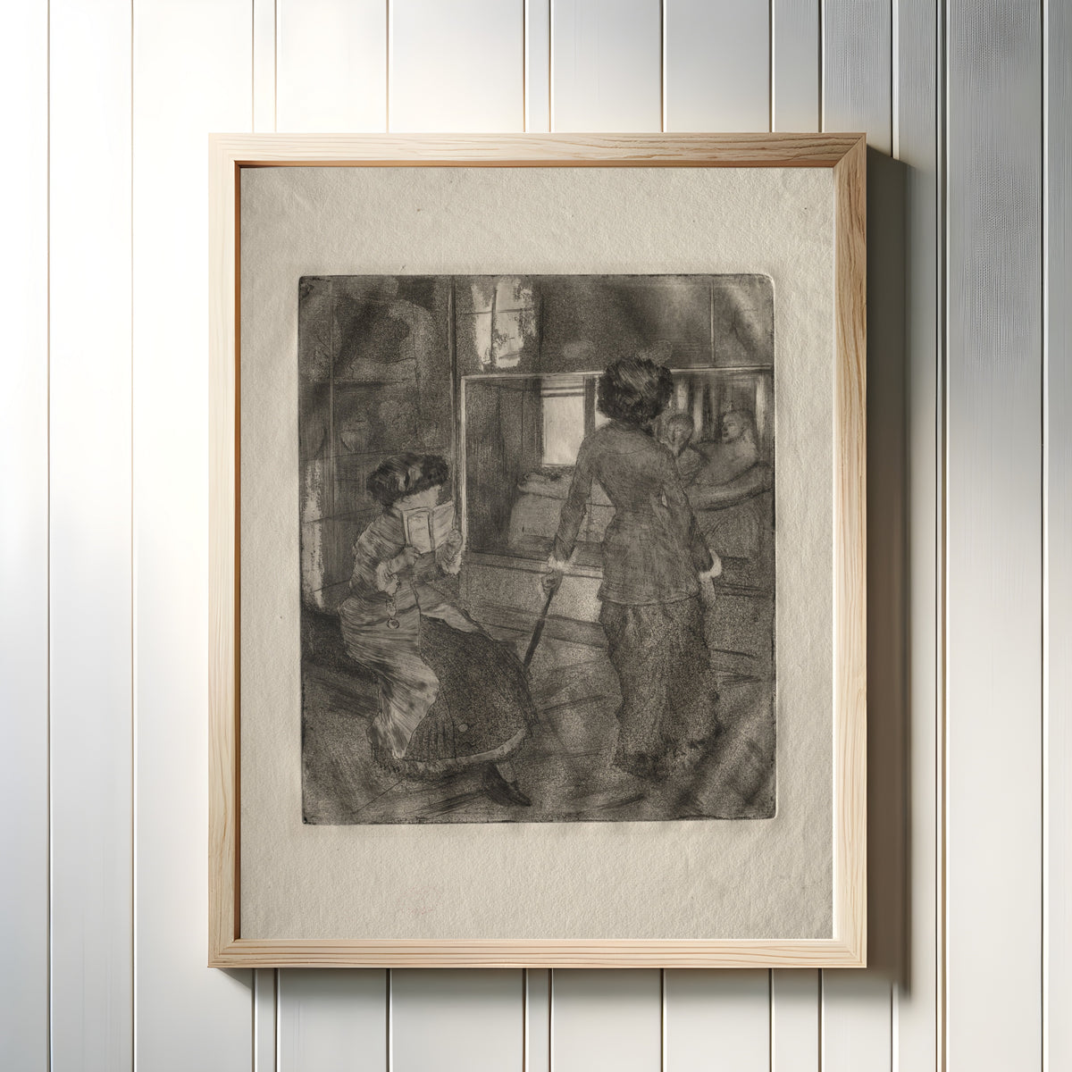 Framed art print of Mary Cassatt at the Louvre: The Etruscan Gallery by Edgar Degas, in a light wood frame on a white panelled wall