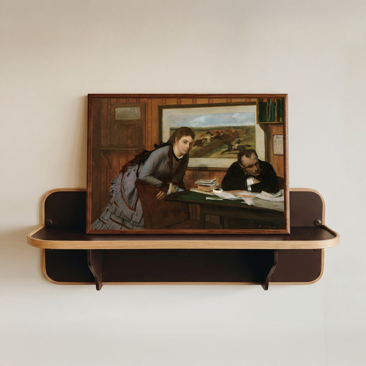 Framed art print of Sulking by Edgar Degas, in a dark wood frame resting on a wall shelf