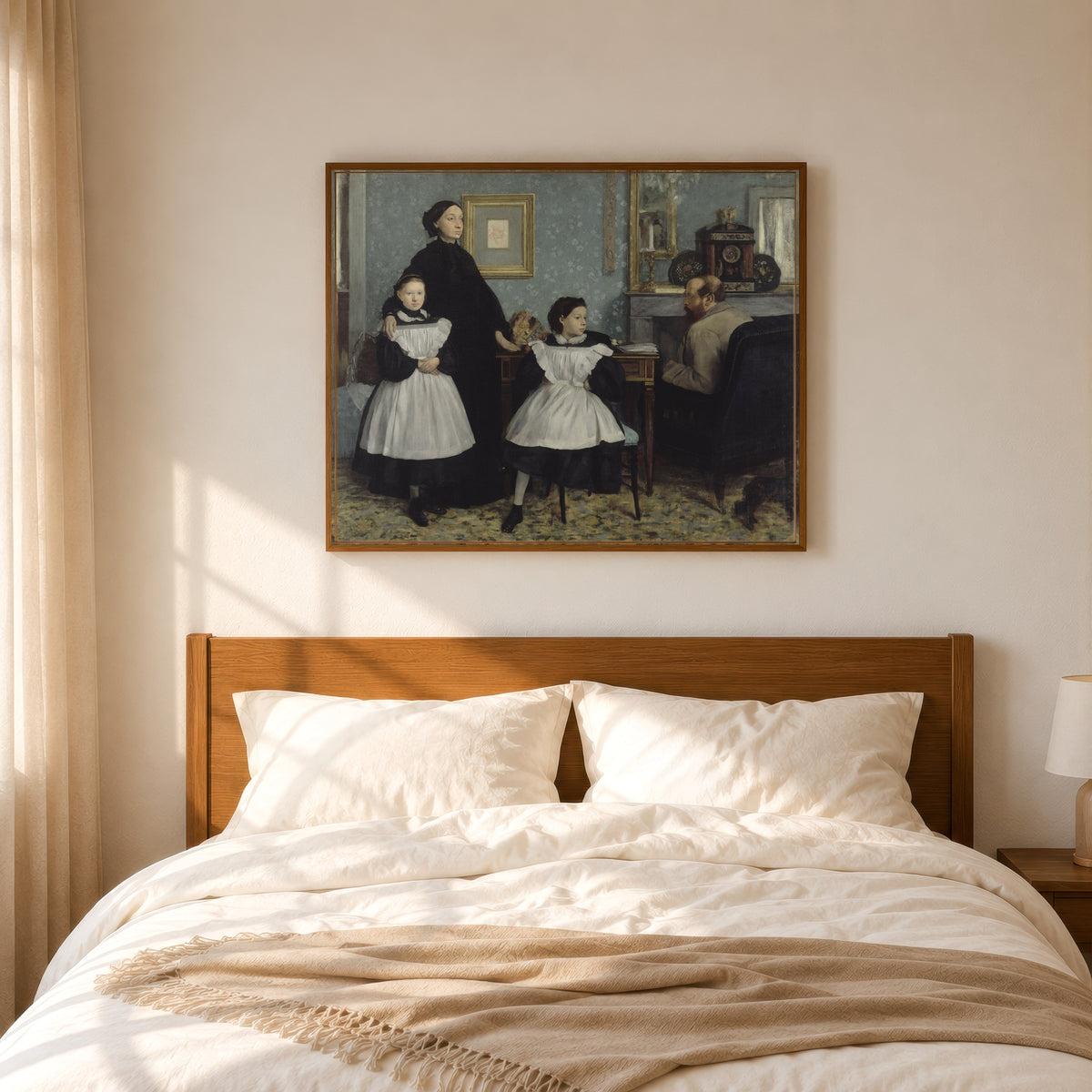 Framed art print of The Bellelli Family by Edgar Degas, in a slim wood frame above a bed in a sunlit bedroom