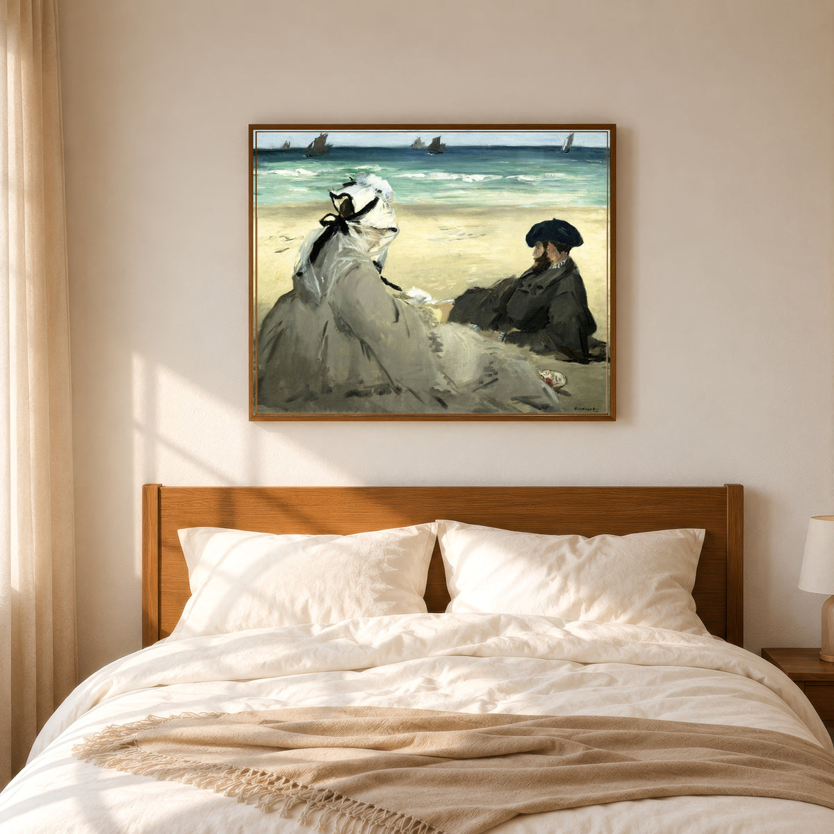 Framed art print of On the Beach by Édouard Manet, in a slim wood frame above a bed in a sunlit bedroom