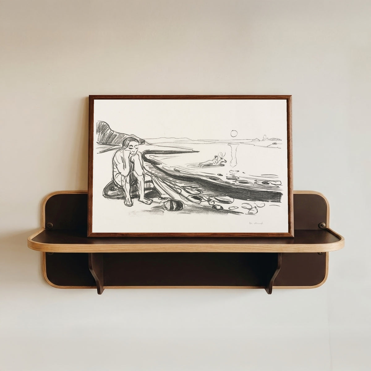 Framed art print of Alpha and Omega: Omega's Flight by Edvard Munch, in a dark wood frame resting on a wall shelf