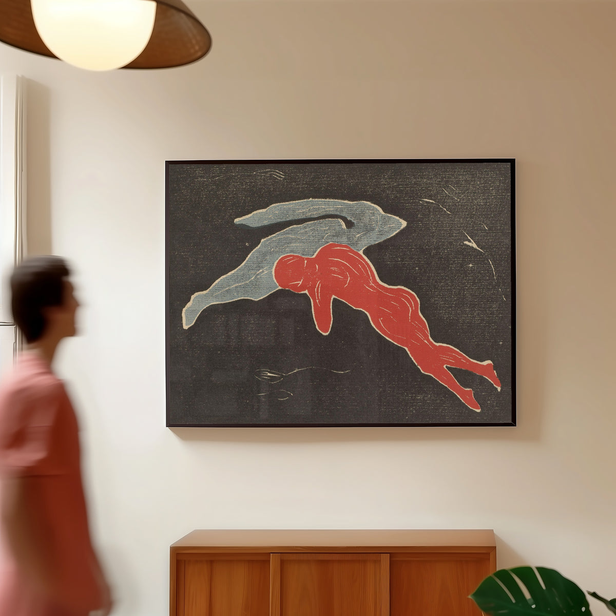 Framed art print of Encounter in Space by Edvard Munch, in a slim black frame on a warm wall in a sunlit room