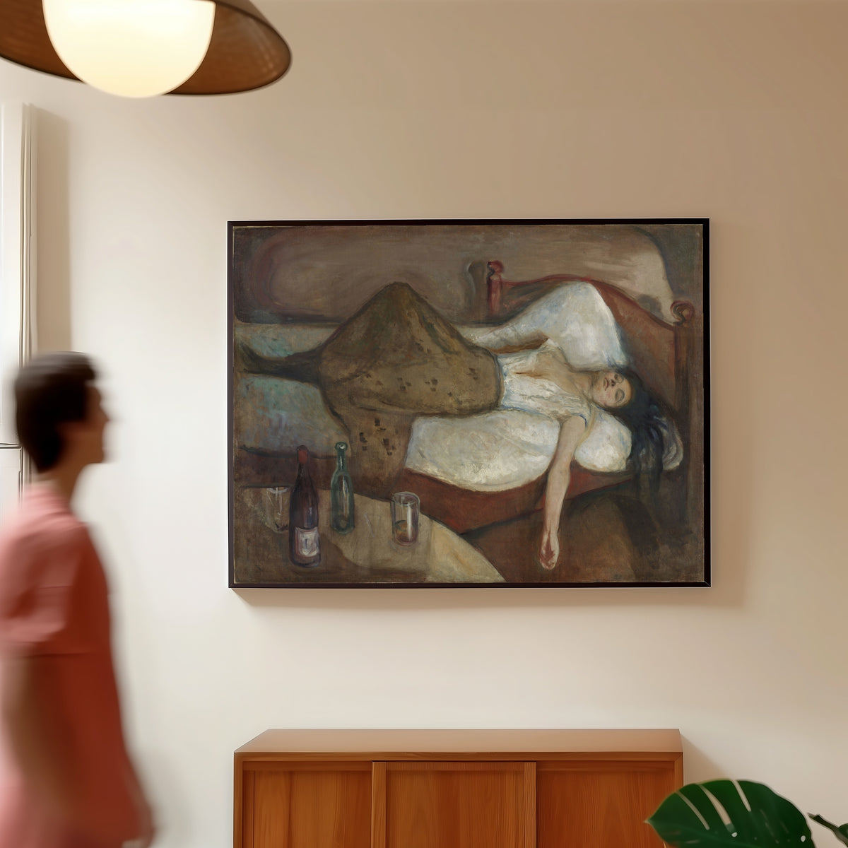 Framed art print of The Day After by Edvard Munch, in a slim black frame on a warm wall in a sunlit room