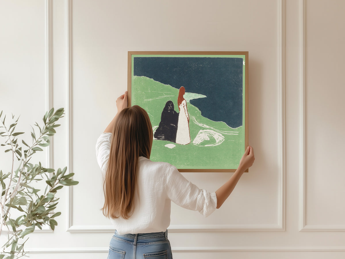 Two Women on the Shore by Edvard Munch — being hung, framed, on a panelled wall