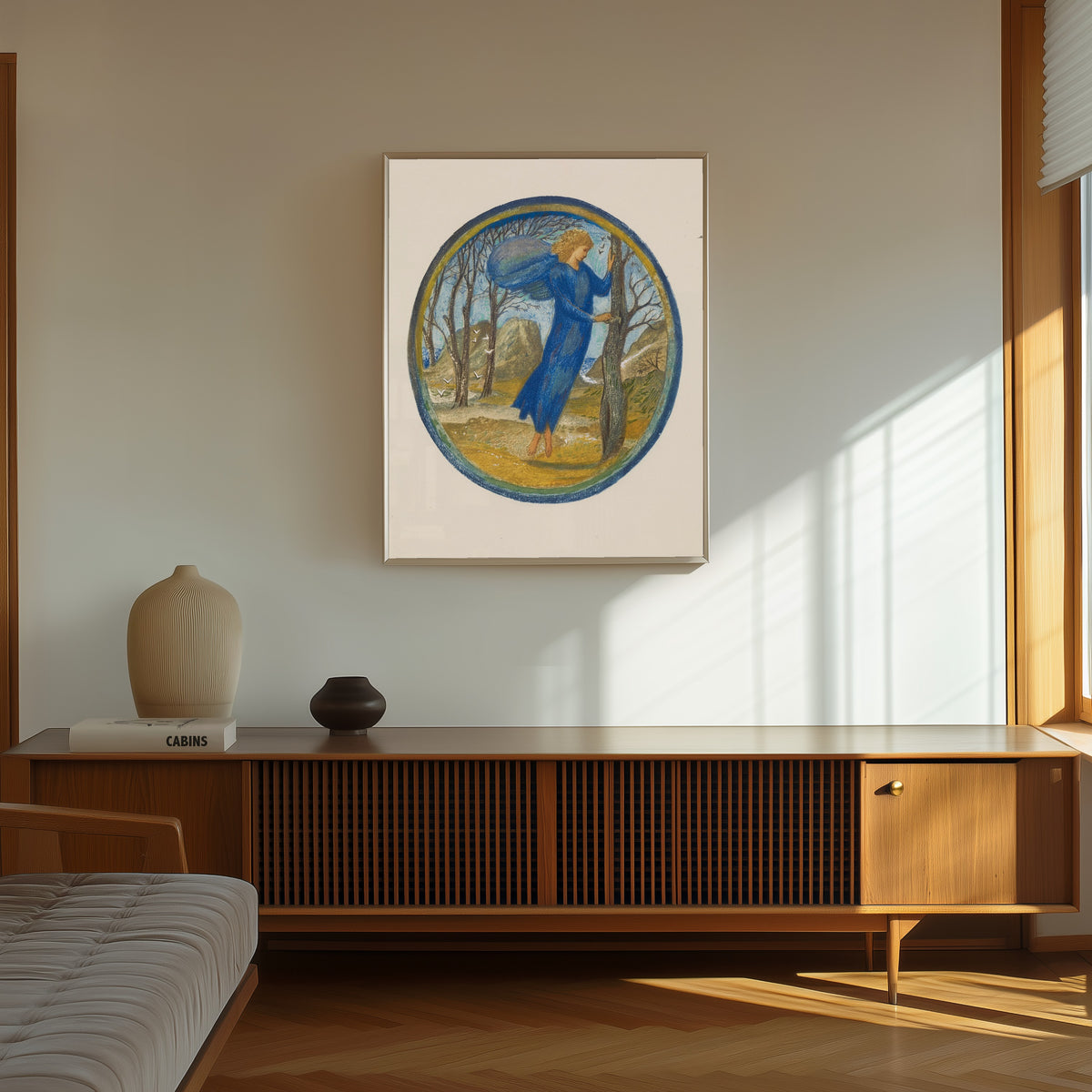 Framed art print of The Flower Book: Key of Spring by Edward Burne-Jones, in a thin light frame on a sunlit wall above a wooden sideboard