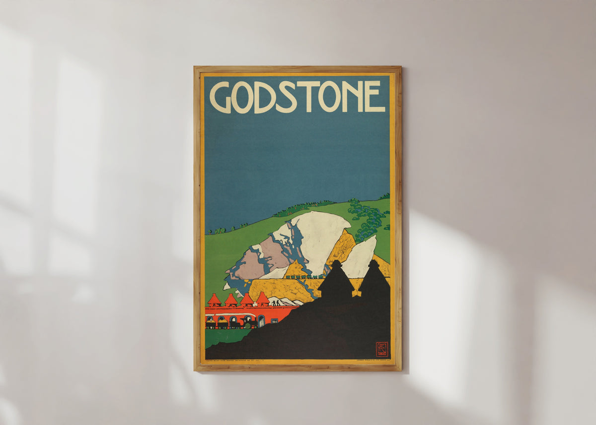 Framed art print of Godstone by Edward McKnight Kauffer, in a light wood frame on a sunlit white wall