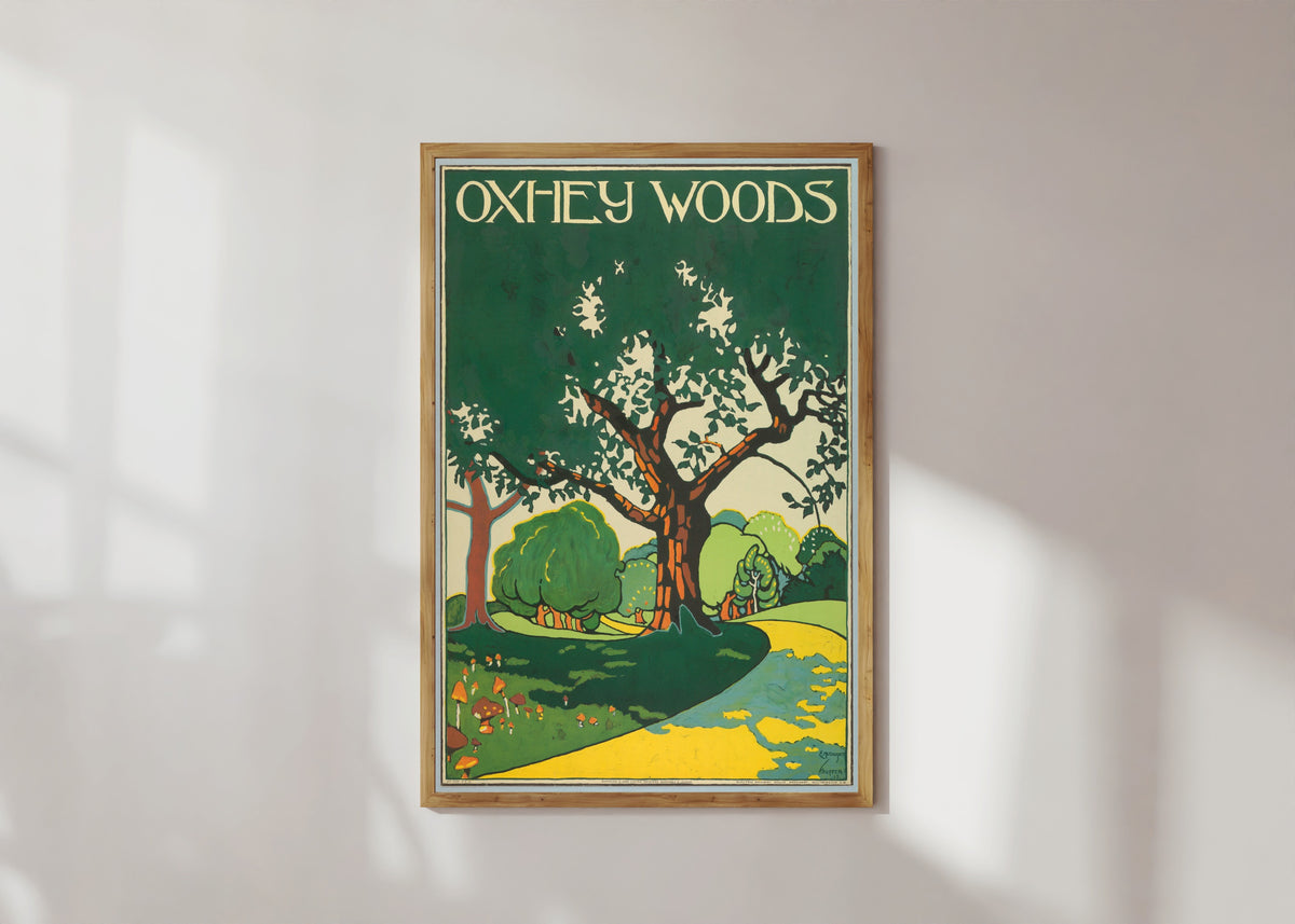 Framed art print of Oxhey Woods by Edward McKnight Kauffer, in a light wood frame on a sunlit white wall