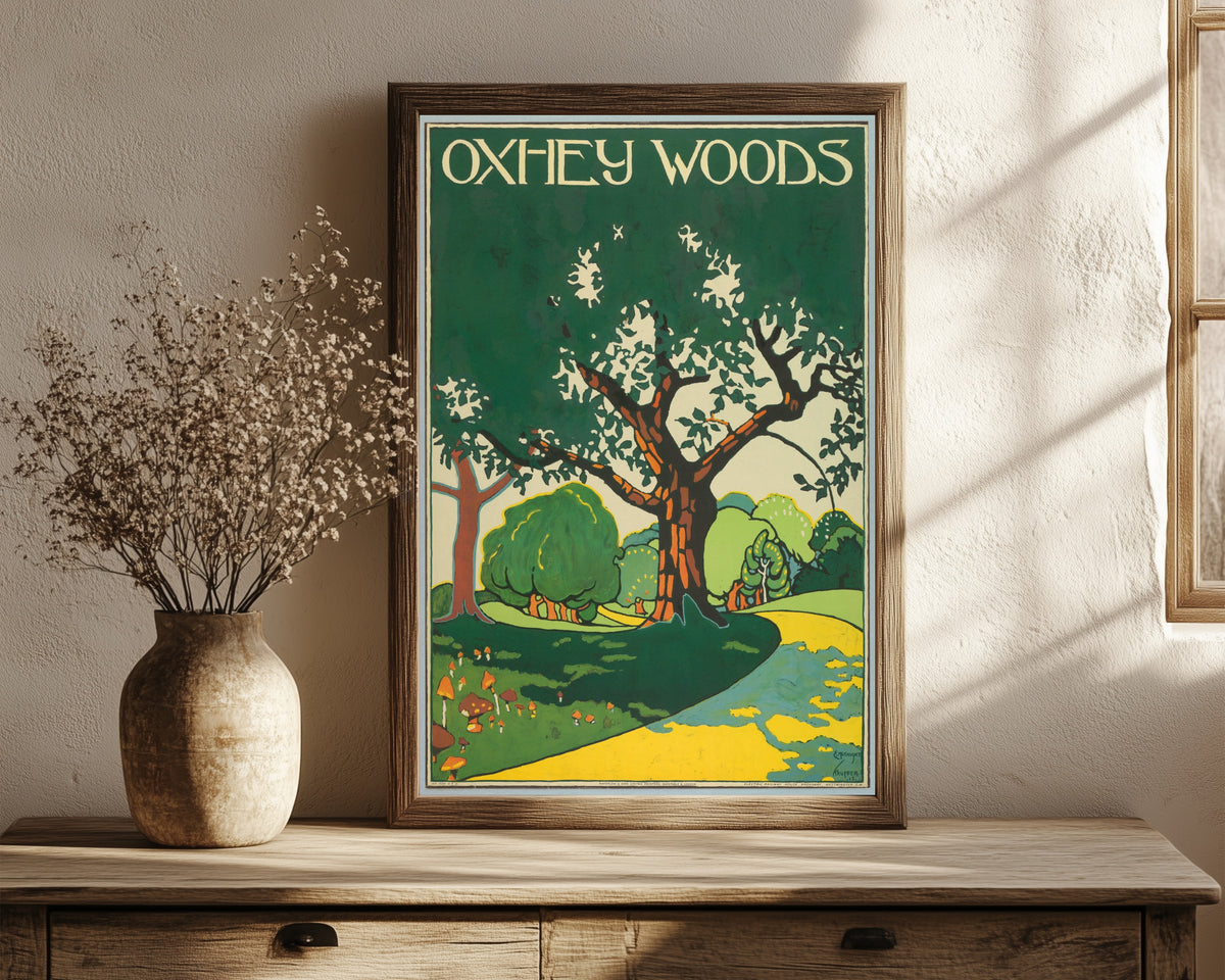 Framed art print of Oxhey Woods by Edward McKnight Kauffer, in a dark wood frame leaning on a rustic console beside dried flowers