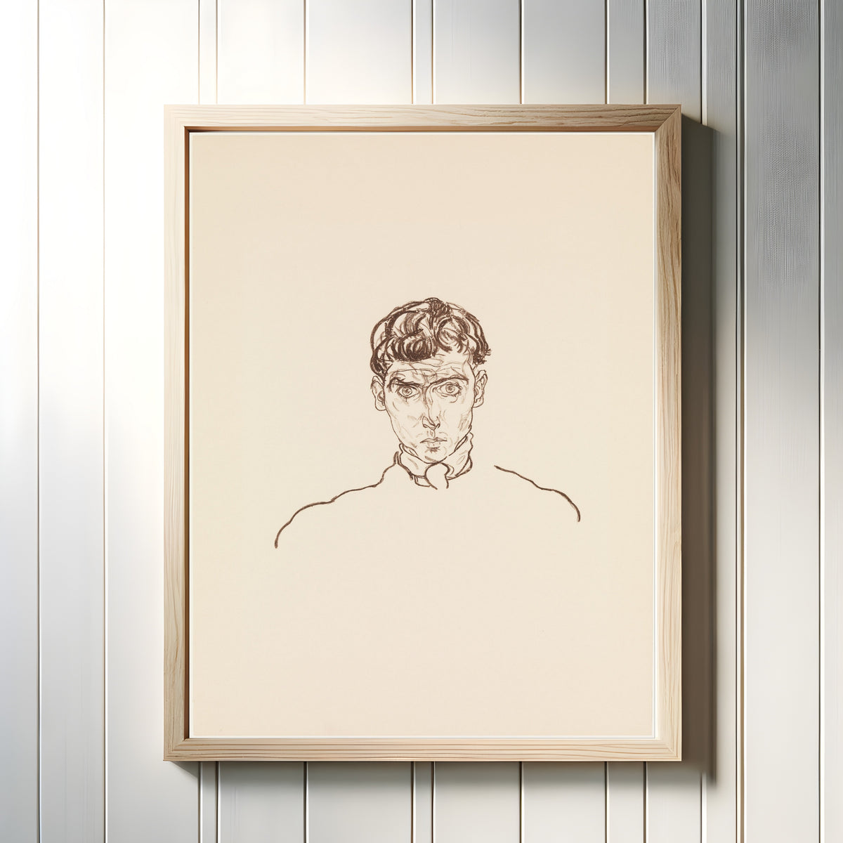 Framed art print of Portrait of Paris von Gütersloh by Egon Schiele, in a light wood frame on a white panelled wall