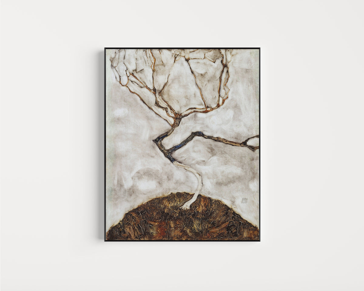 Framed art print of Small Tree in Late Autumn by Egon Schiele, in a slim black frame on a plain white wall