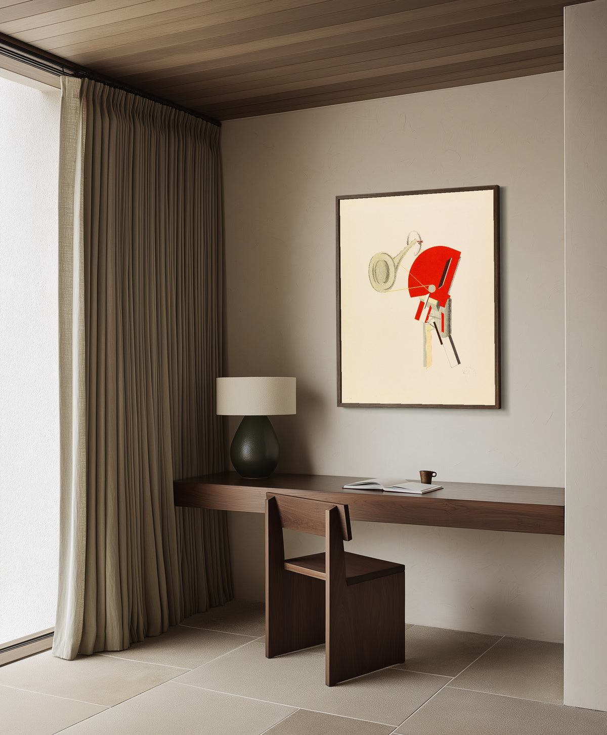 Framed art print of Figurines: The Announcer (Ansager) by El Lissitzky, in a dark wood frame on a plaster wall above a walnut desk