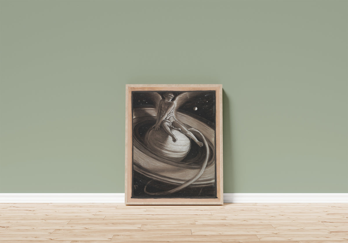 Framed art print of The Throne of Saturn (1883) by Elihu Vedder, in a light wood frame leaning on a sage green wall above a wooden floor