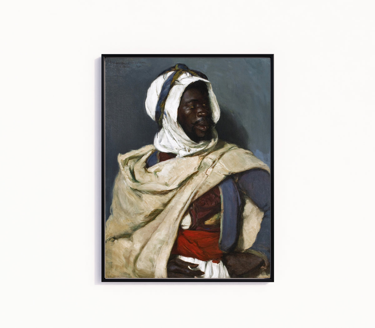 Framed art print of An Algerian Man by Elizabeth Nourse, in a slim black frame on a plain white wall