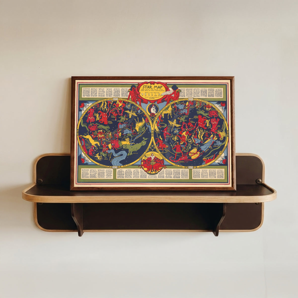 Framed art print of Star Map by Elizabeth Shurtleff, in a dark wood frame resting on a wall shelf
