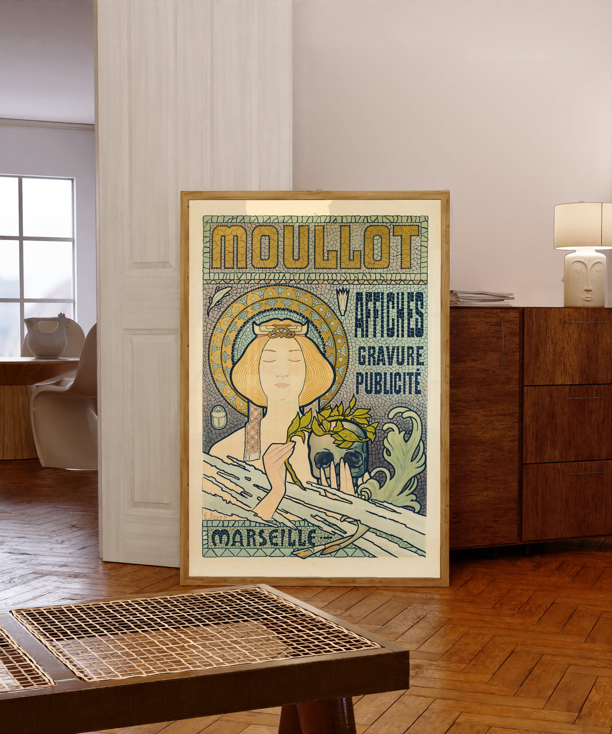 Framed art print of Moullot Marseille by Eugène Roux, in a light wood frame leaning in a warm room with a parquet floor