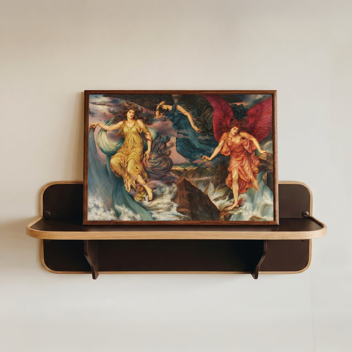 Framed art print of The Storm Spirits by Evelyn De Morgan, in a dark wood frame resting on a wall shelf