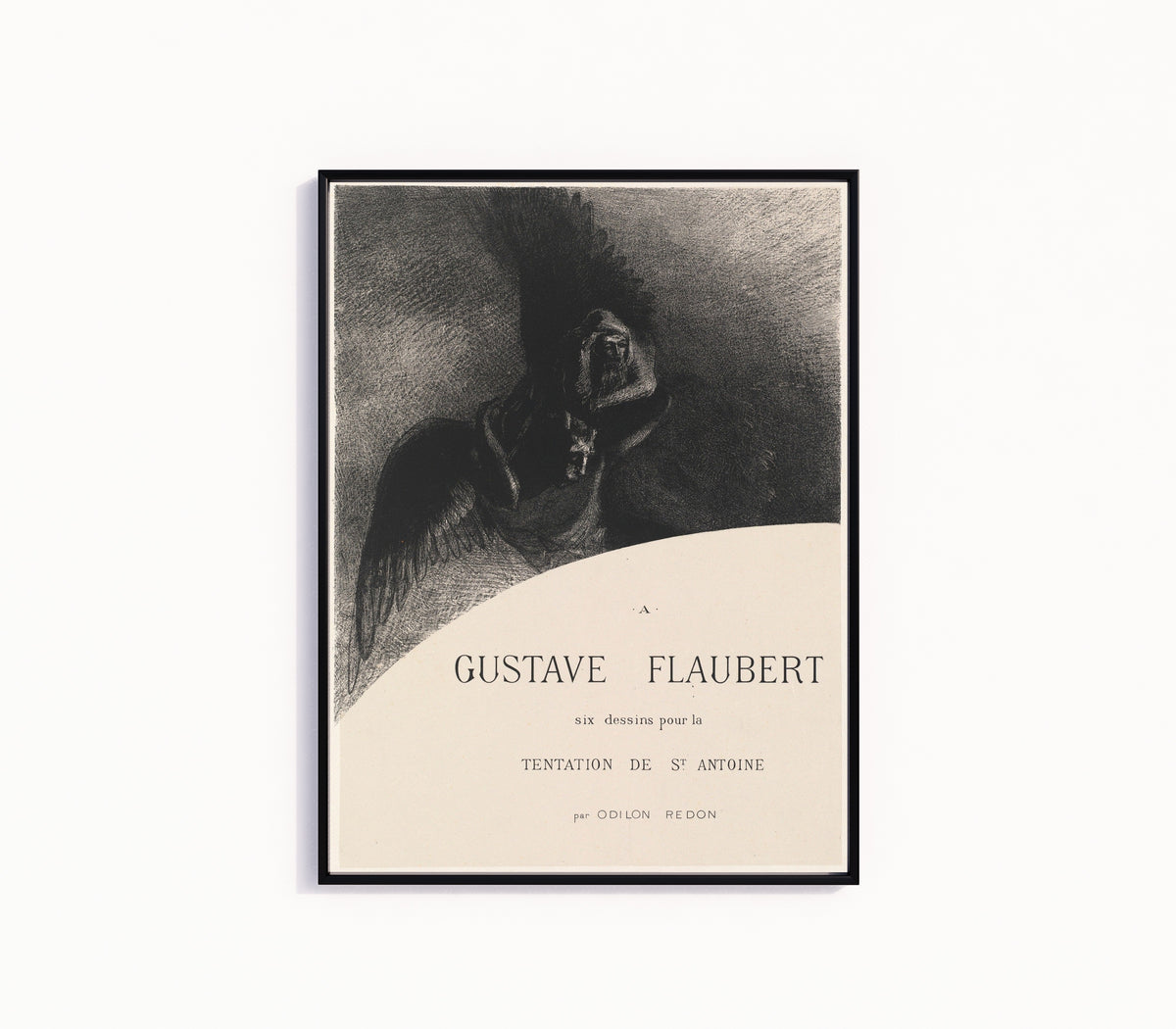 Framed art print of The Temptation of Saint Anthony by Odilon Redon, in a slim black frame on a plain white wall