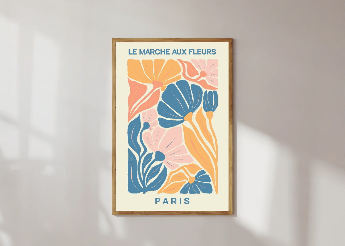 Framed art print of Paris by Original, in a light wood frame on a sunlit white wall