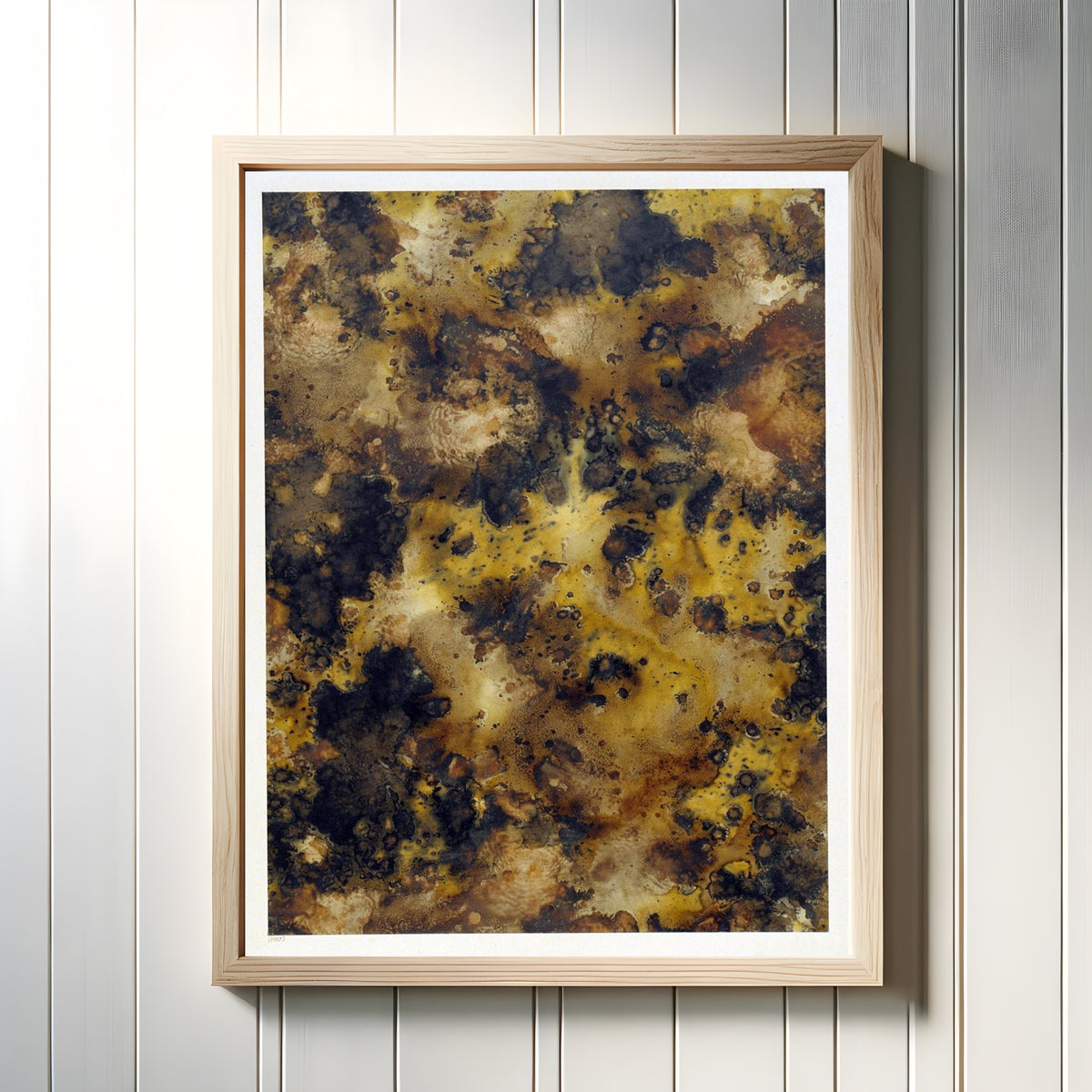 Framed art print of Graphik Paper by Historical Surface Studies, in a light wood frame on a white panelled wall