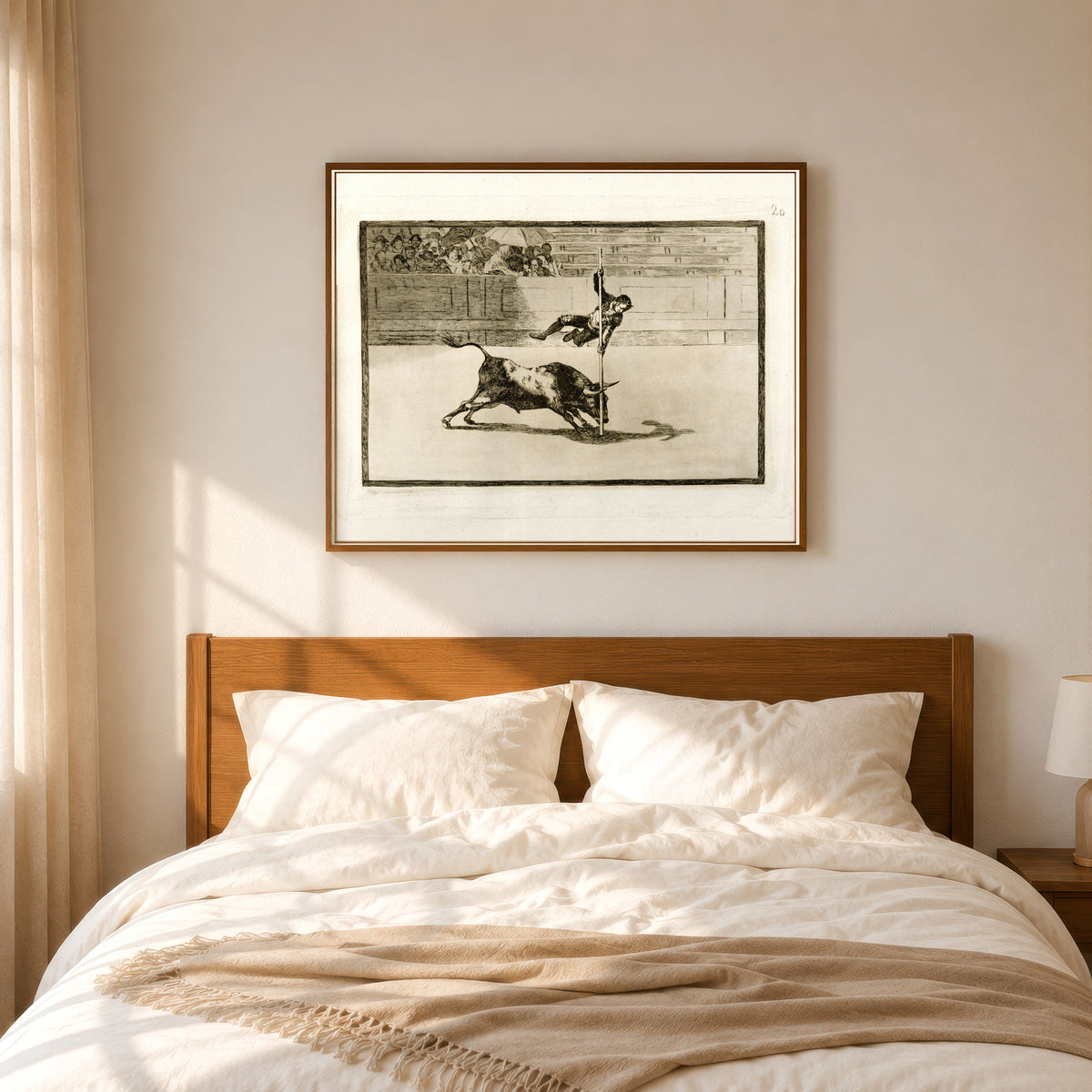 Framed art print of Ligereza y atrevimiento de Juanito Apiñani en la de Madrid (The… by Francisco de Goya, in a slim wood frame above a bed in a sunlit bedroom