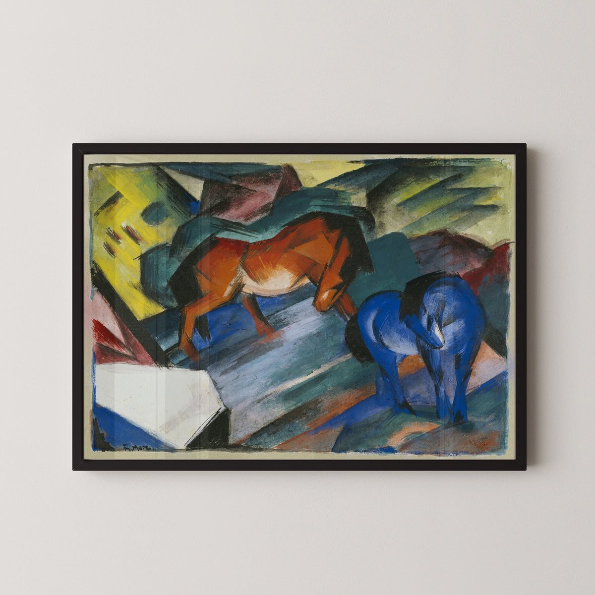 Red and Blue Horse by Franz Marc — in a black frame on a pale wall