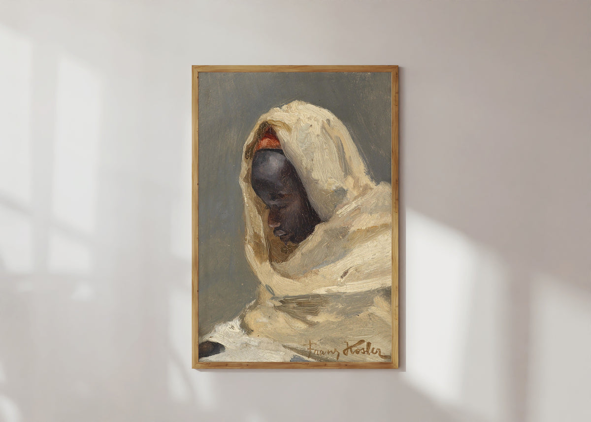 Framed art print of A Bedouin Man by Franz Xaver Kosler, in a light wood frame on a sunlit white wall