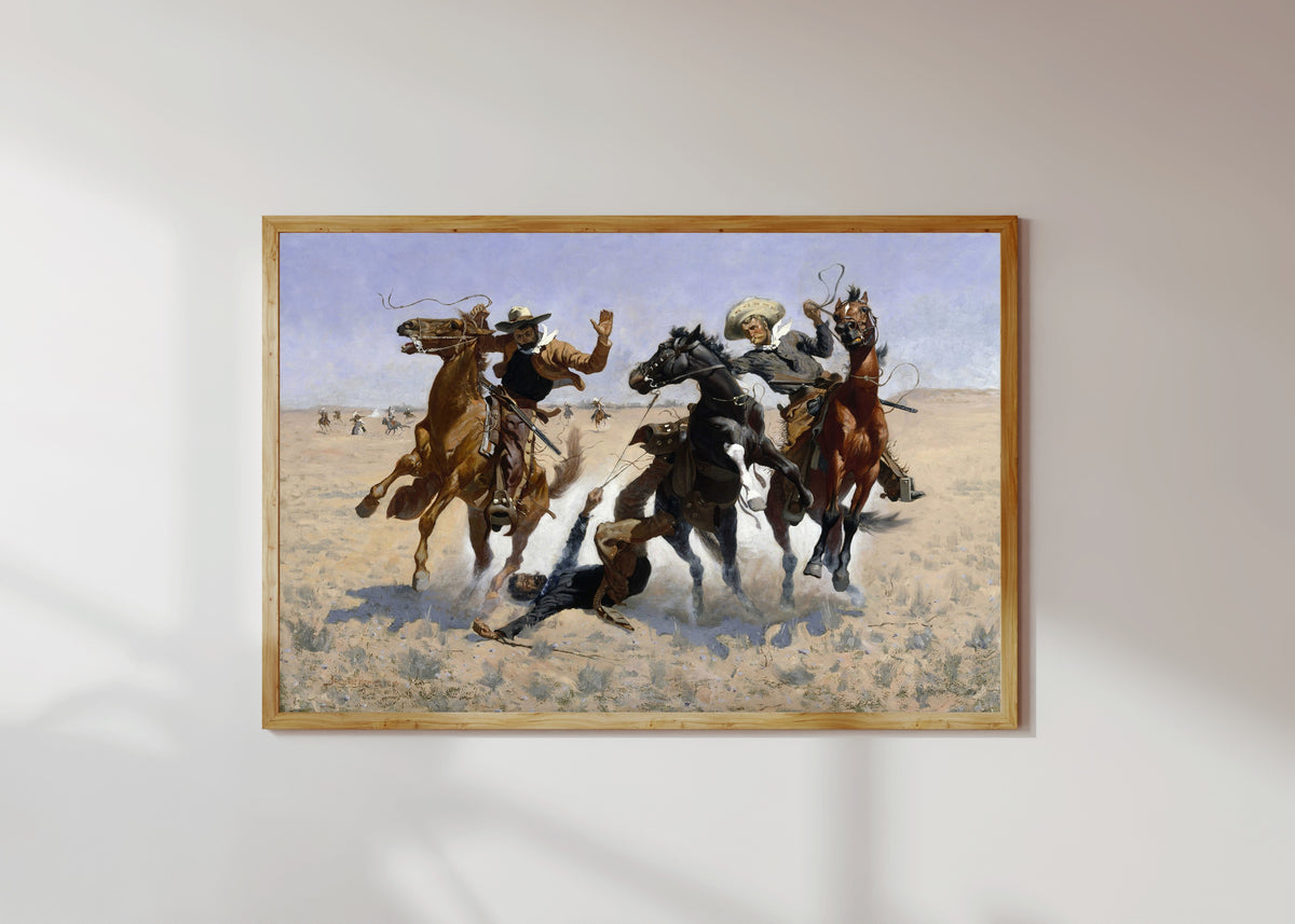 Framed art print of Aiding a Comrade by Frederic Remington, in a light wood frame on a sunlit white wall