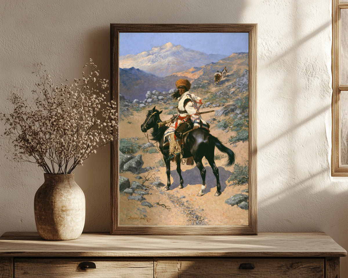 Framed art print of An Indian Trapper by Frederic Remington, in a dark wood frame leaning on a rustic console beside dried flowers