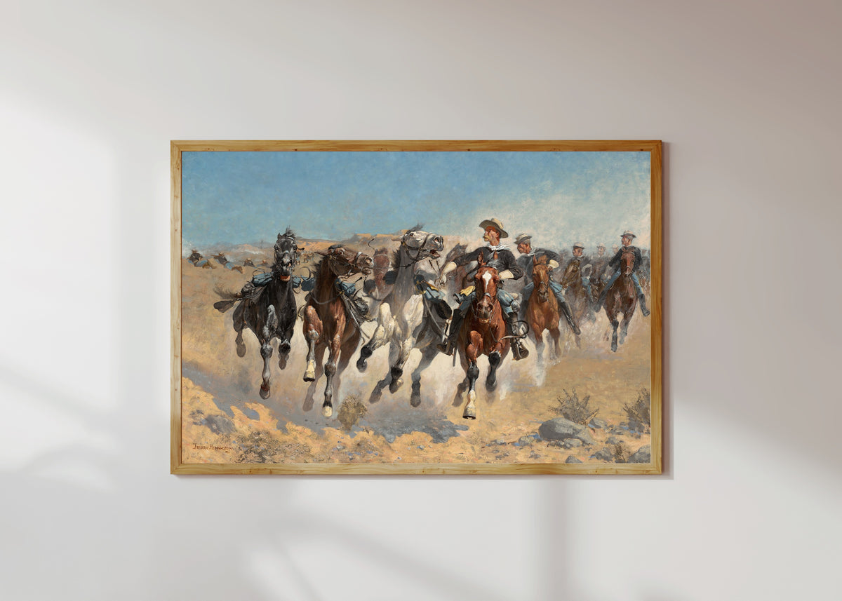 Framed art print of Dismounted: The Fourth Troopers Moving the Led Horses by Frederic Remington, in a light wood frame on a sunlit white wall