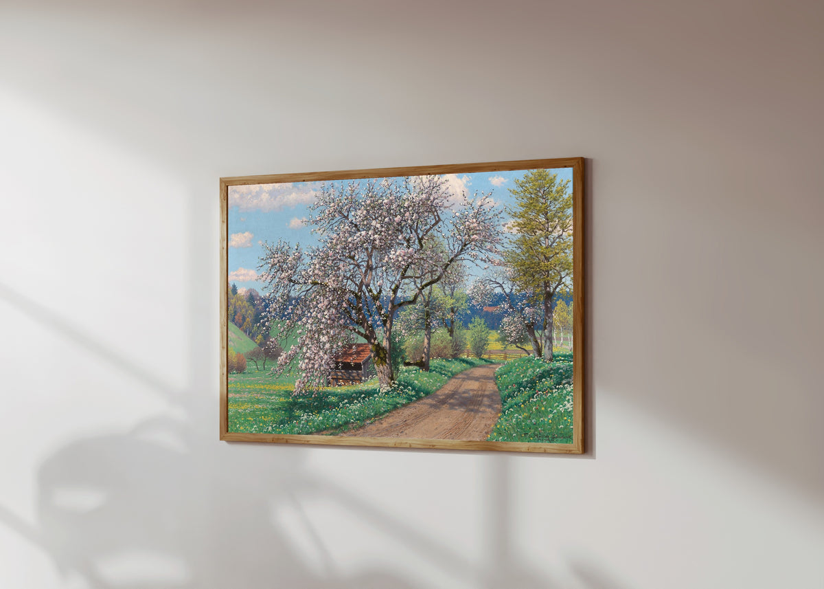 Framed art print of A Spring Day by Fritz Müller-Landeck, in a light wood frame on a sunlit white wall, seen at a slight angle