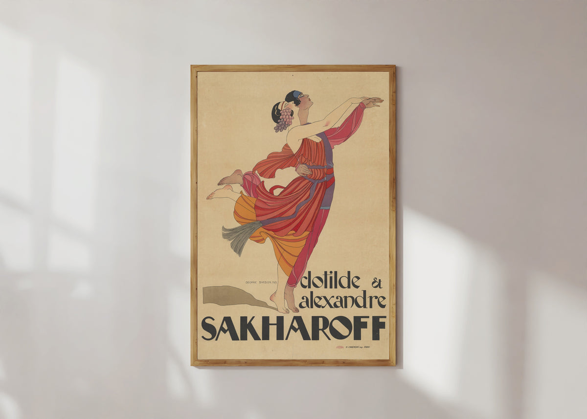Framed art print of Clotilde et Alexandre Sakharoff by George Barbier, in a light wood frame on a sunlit white wall