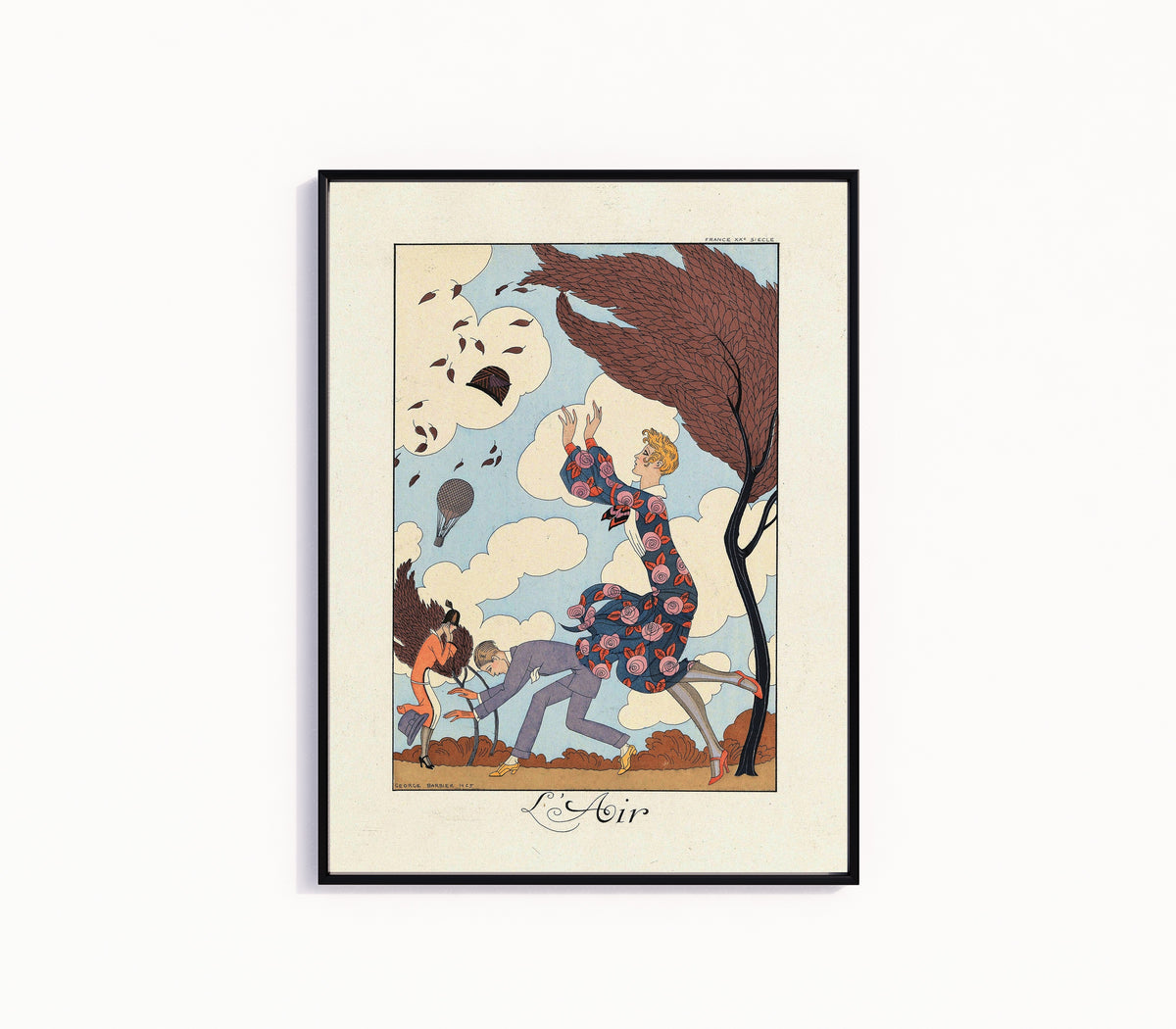 Framed art print of L'Air by George Barbier, in a slim black frame on a plain white wall