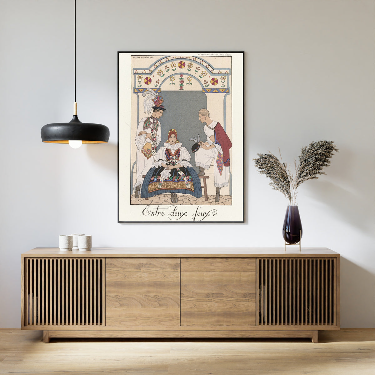 Entre deux feux by George Barbier — framed above a slatted wood sideboard