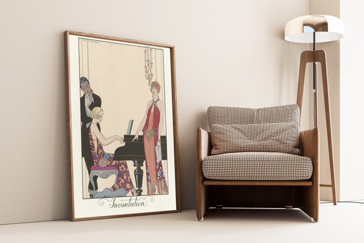 Incantation by George Barbier — framed and leaning against a wall beside an armchair and a floor lamp