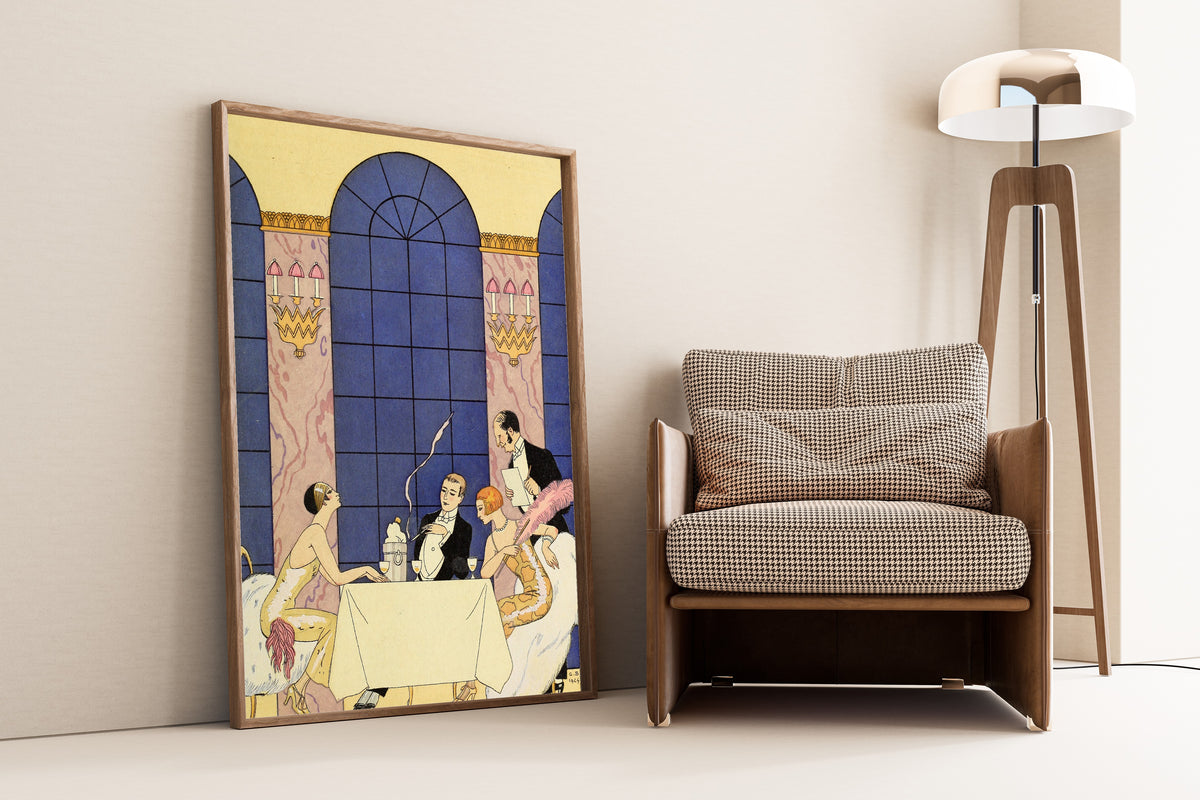 La Gourmandise [Gluttony] by George Barbier — framed and leaning against a wall beside an armchair and a floor lamp