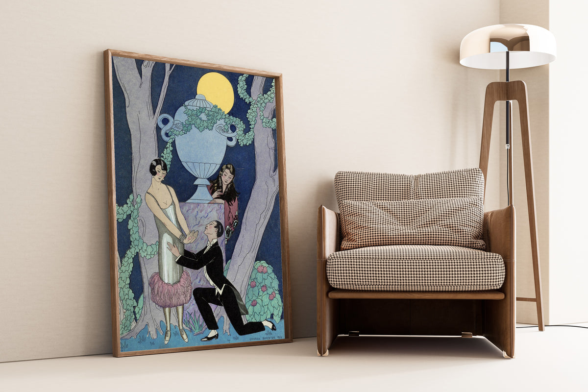 L'Avarice [Avarice] by George Barbier — framed and leaning against a wall beside an armchair and a floor lamp