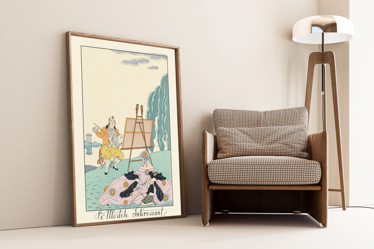Le Modèle intéressant by George Barbier — framed and leaning against a wall beside an armchair and a floor lamp