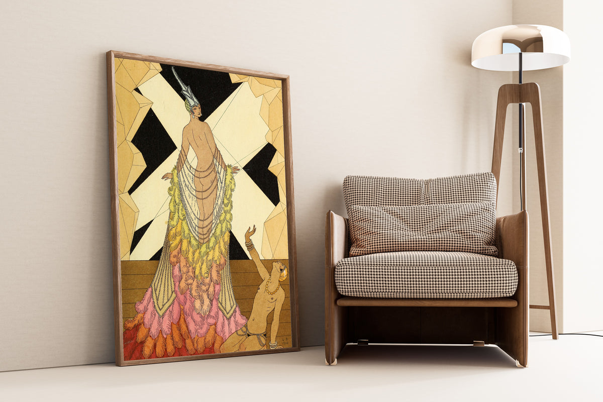 L'Orgueil [Pride] by George Barbier — framed and leaning against a wall beside an armchair and a floor lamp