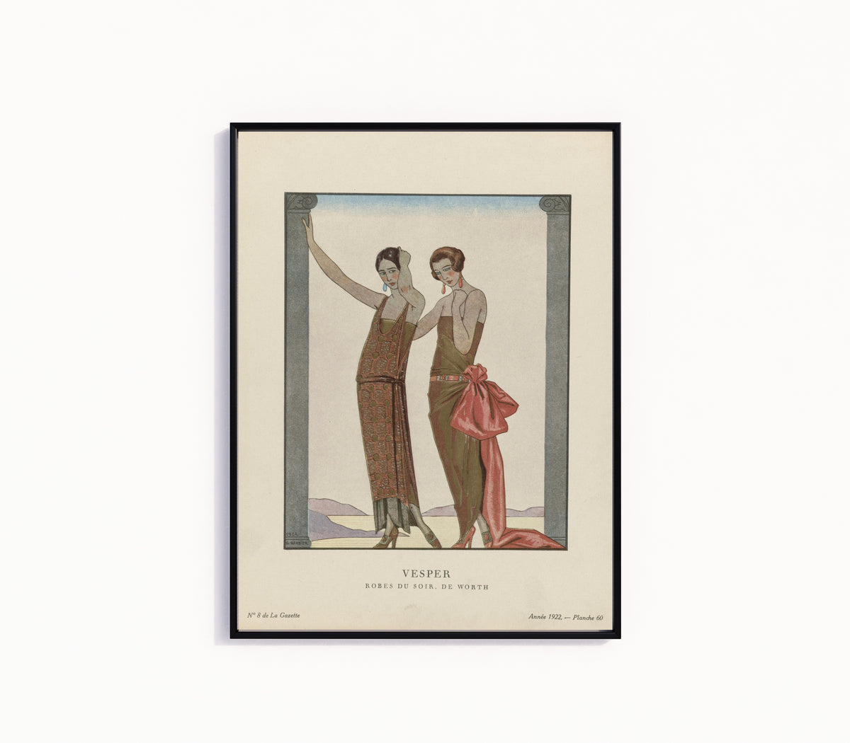 Framed art print of Vesper, robes du soir de Worth by George Barbier, in a slim black frame on a plain white wall