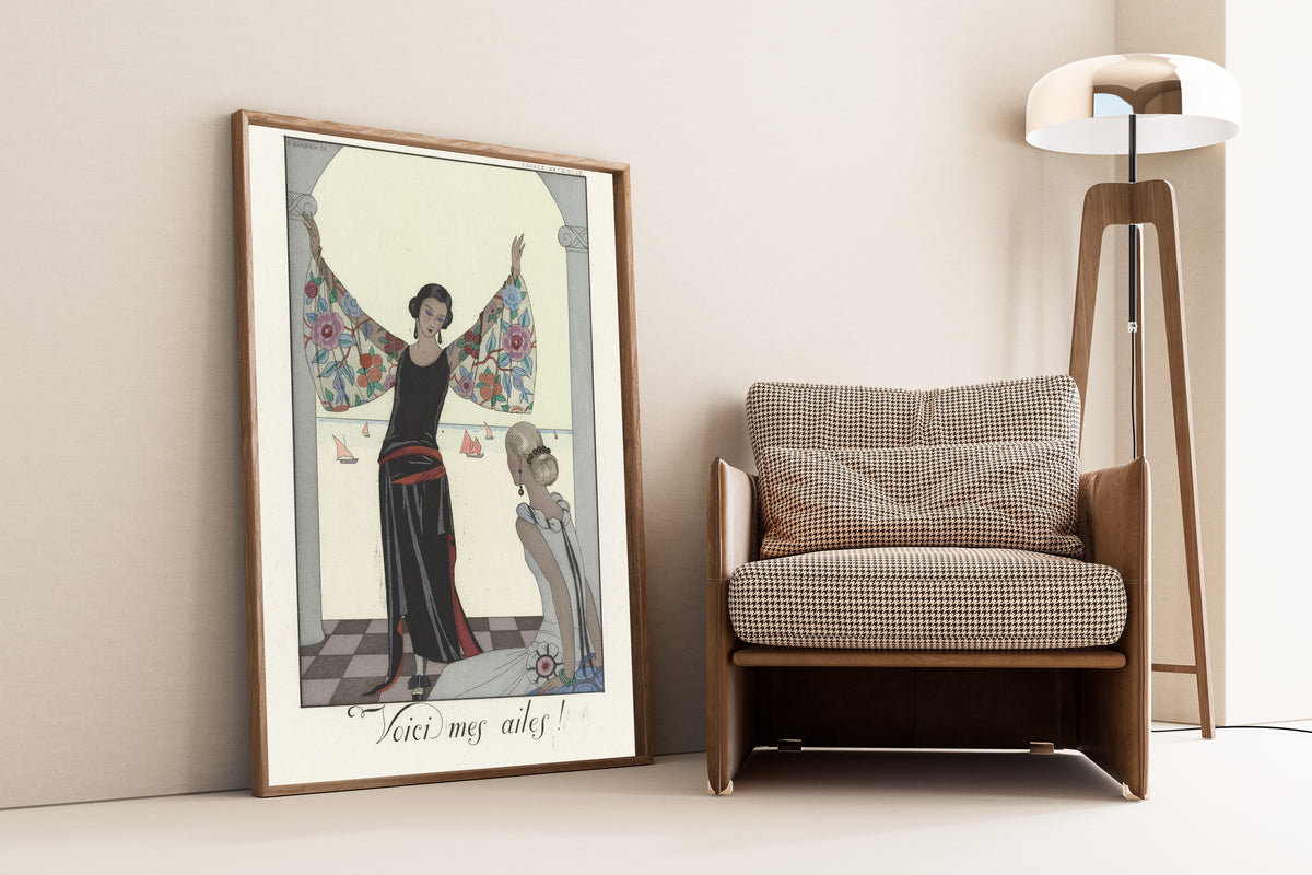 Voici mes ailes! by George Barbier — framed and leaning against a wall beside an armchair and a floor lamp