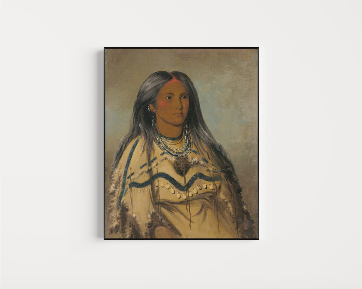 Framed art print of Sha-kó-ka, Mint, a Pretty Girl by George Catlin, in a slim black frame on a plain white wall