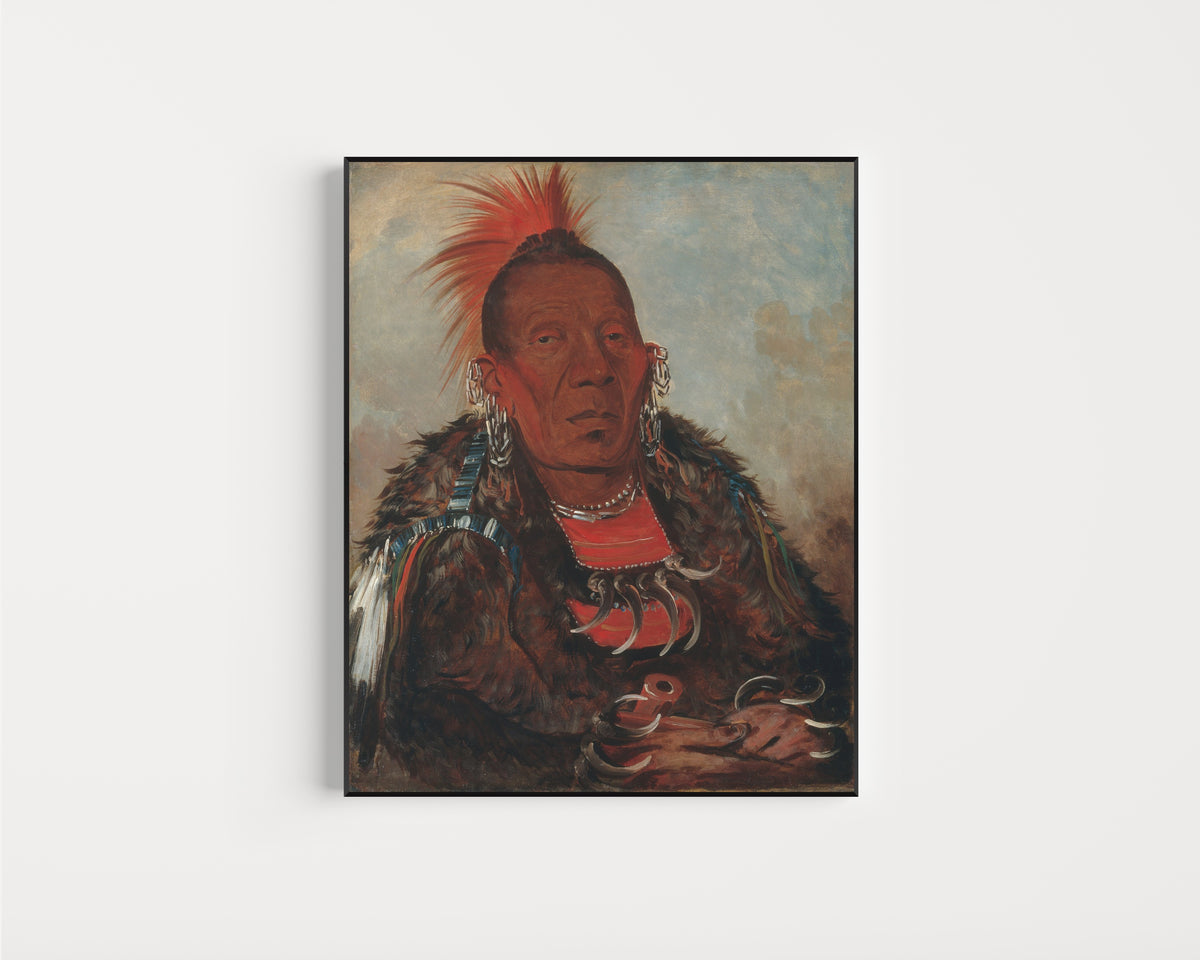 Framed art print of Wah-ro-née-sah, The Surrounder, Chief of the Tribe by George Catlin, in a slim black frame on a plain white wall