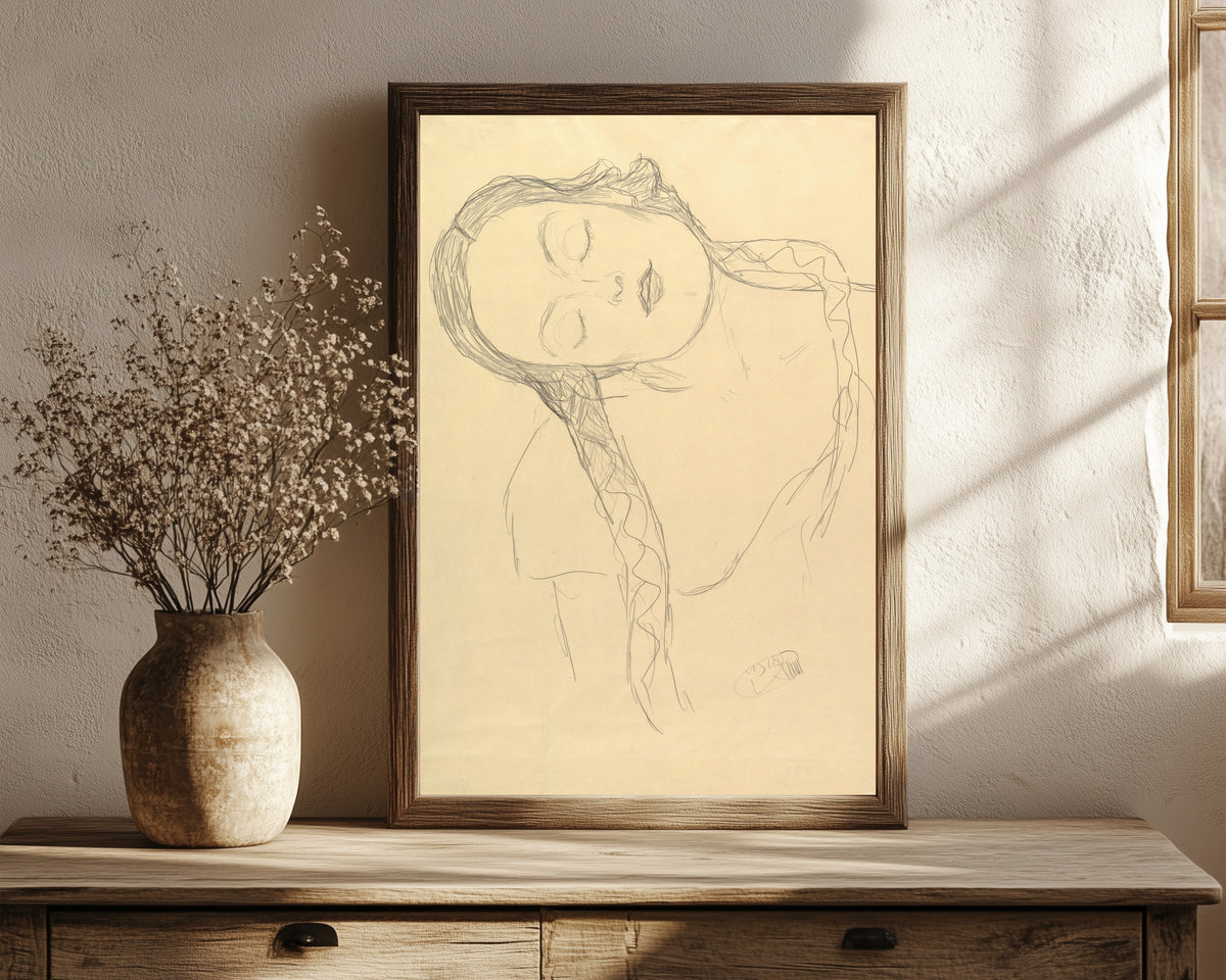 Framed art print of Half-figure of a Young Woman by Gustav Klimt, in a dark wood frame leaning on a rustic console beside dried flowers