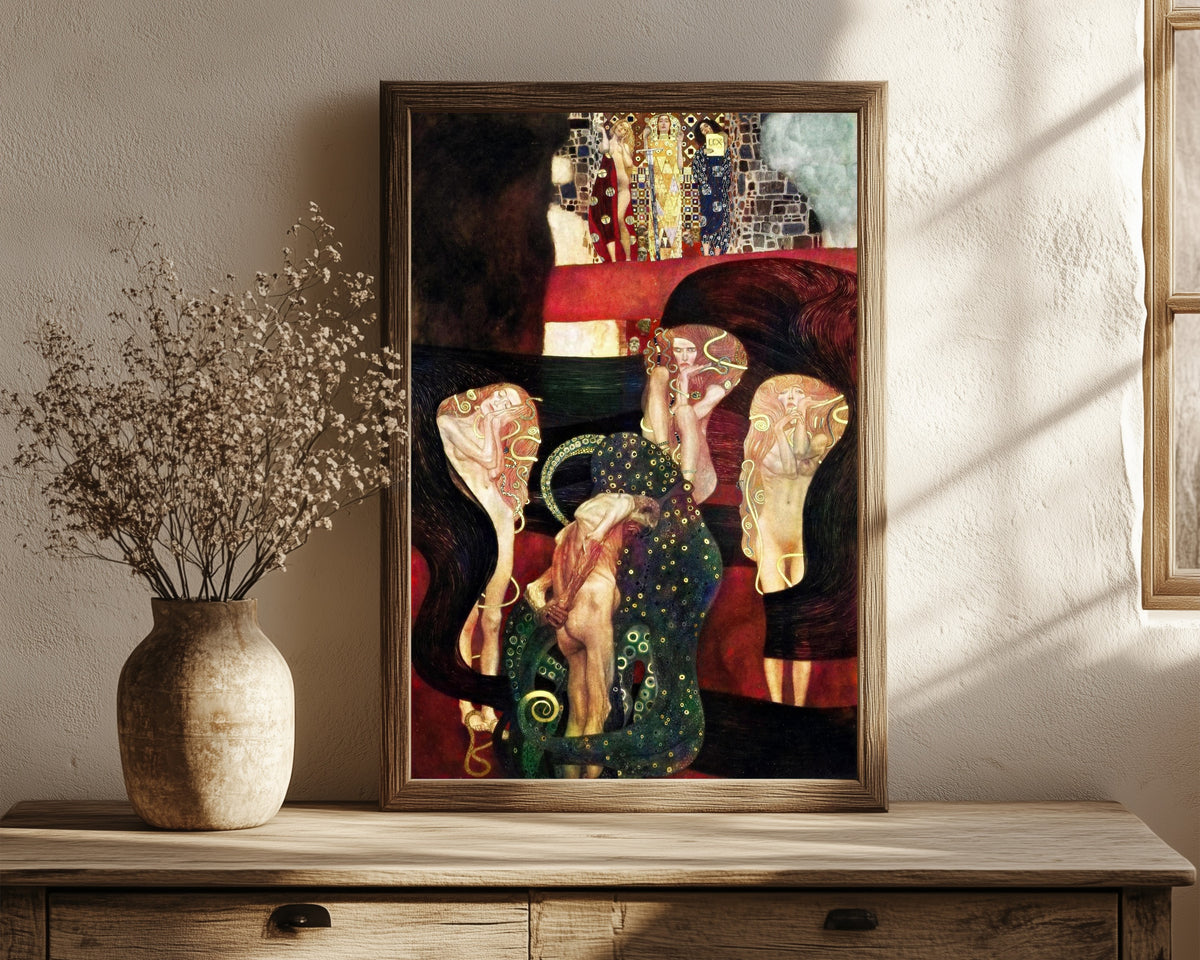 Framed art print of Jurisprudence by Gustav Klimt, in a dark wood frame leaning on a rustic console beside dried flowers