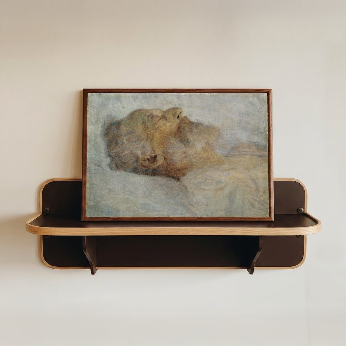 Framed art print of Old Man on his Deathbed (Alter Mann auf dem Totenbett) by Gustav Klimt, in a dark wood frame resting on a wall shelf