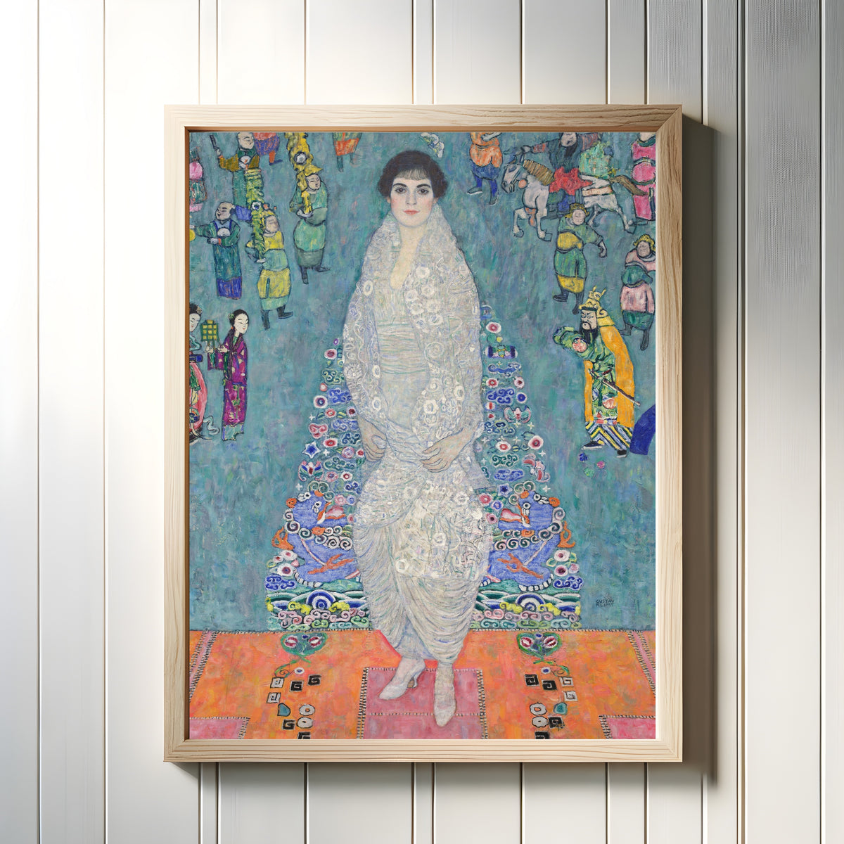 Framed art print of Portrait of Elisabeth Lederer by Gustav Klimt, in a light wood frame on a white panelled wall