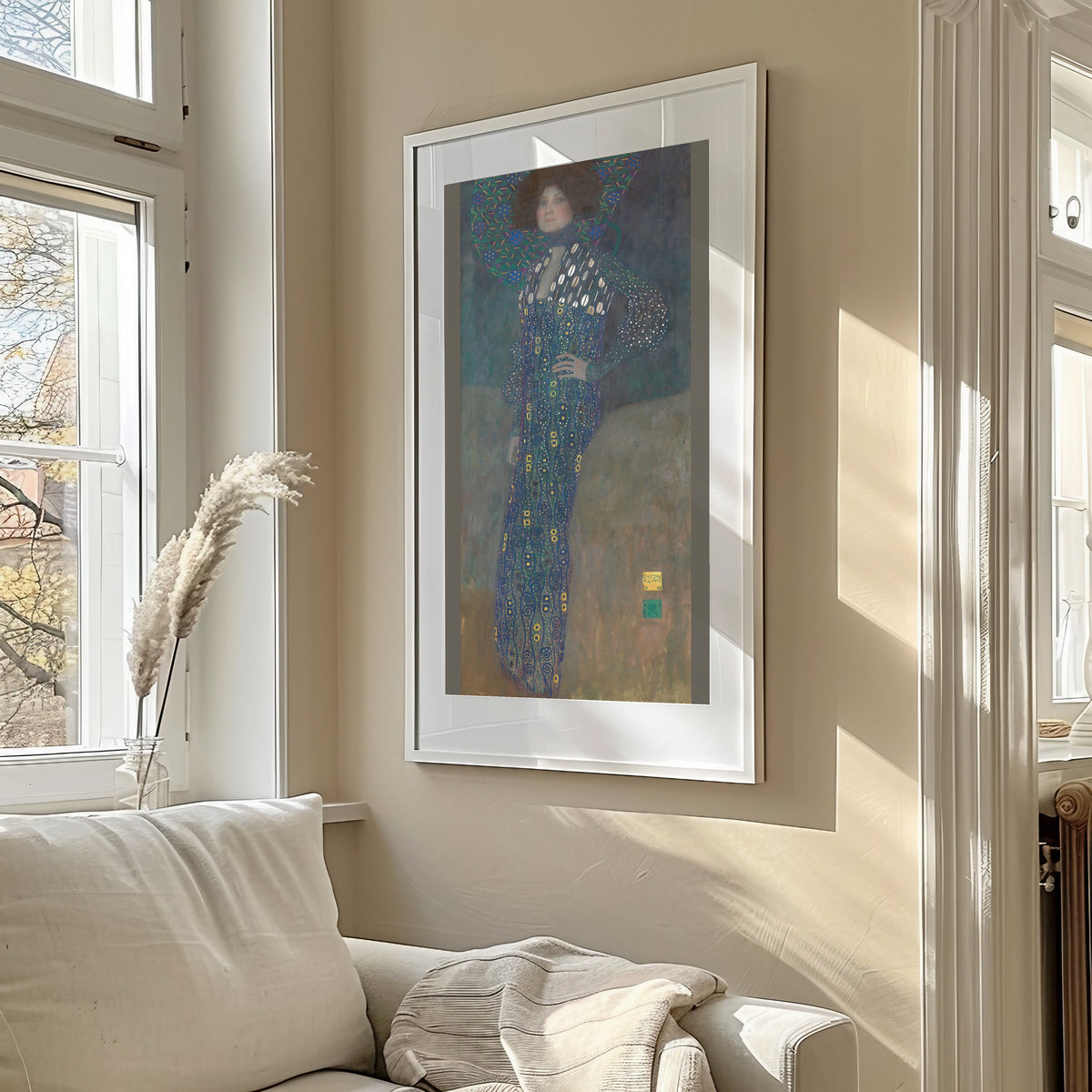 Framed art print of Portrait of Emilie Flöge by Gustav Klimt, in a sunlit living room above a sofa