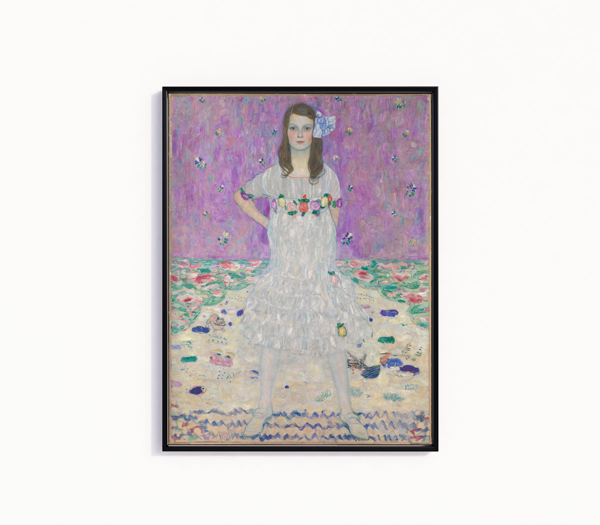 Framed art print of Portrait of Mäda Primavesi by Gustav Klimt, in a slim black frame on a plain white wall