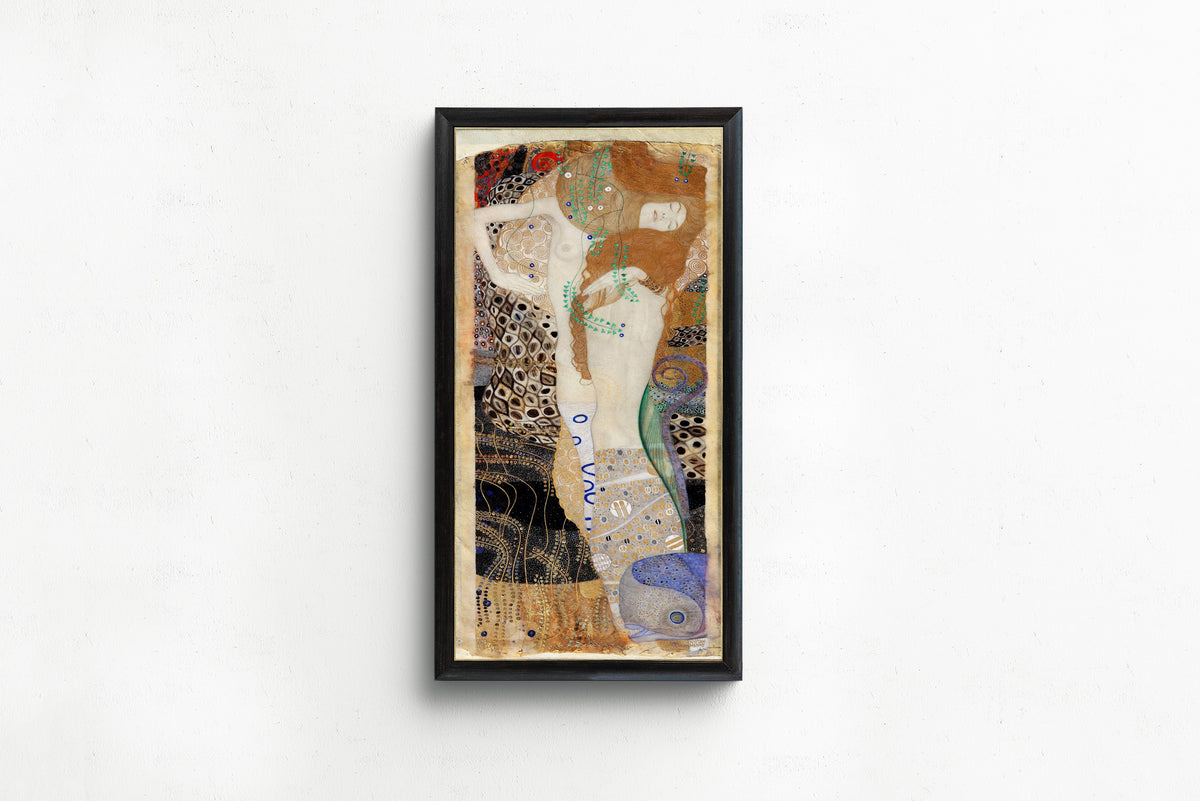 Framed art print of Water Serpents I (Friends) by Gustav Klimt, in a slim black frame on a plain white wall