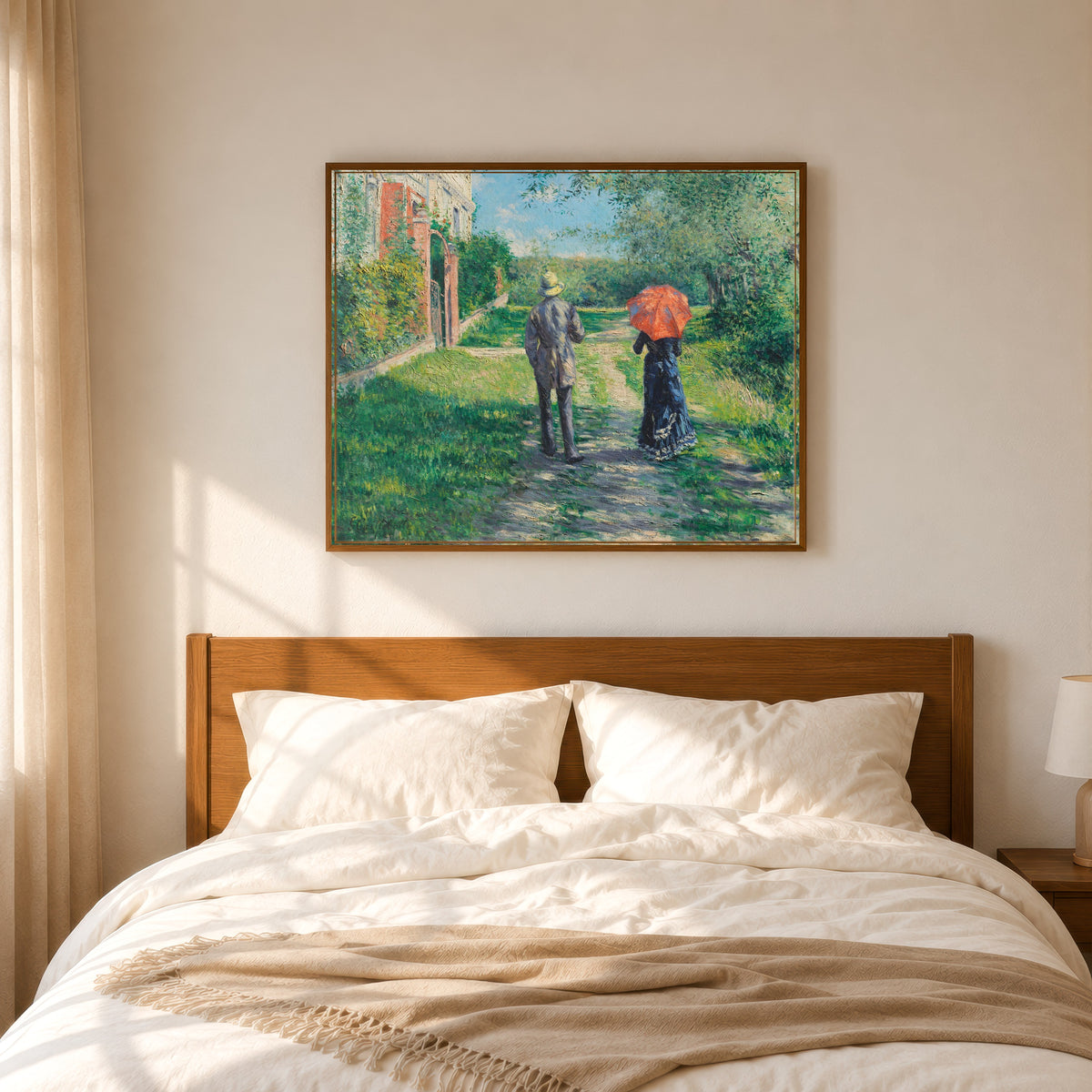 Framed art print of Couple on a Walk (Chemin montant) by Gustave Caillebotte, in a slim wood frame above a bed in a sunlit bedroom
